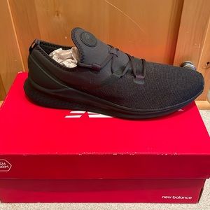 New Balance mens running shoes. Size  12.  Black. Brand new in the box.
